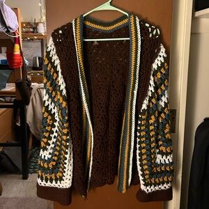 Handmade soft crochet cartigan with earth toned colors.